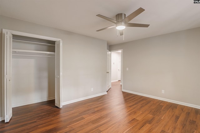 unfurnished bedroom with ceiling fan, dark hardwood / wood-style flooring, and a closet