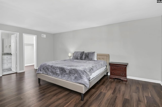 bedroom with dark hardwood / wood-style flooring