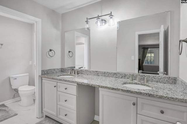 bathroom featuring vanity and toilet