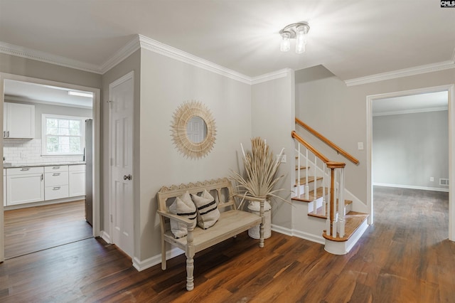 hallway with dark hardwood / wood-style flooring and crown molding