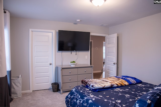 bedroom with light colored carpet