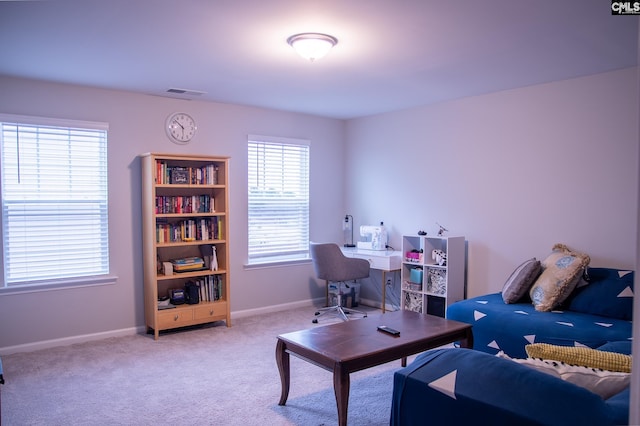 interior space featuring light colored carpet