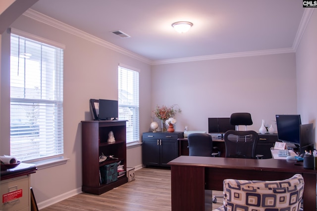 office with crown molding and light hardwood / wood-style floors