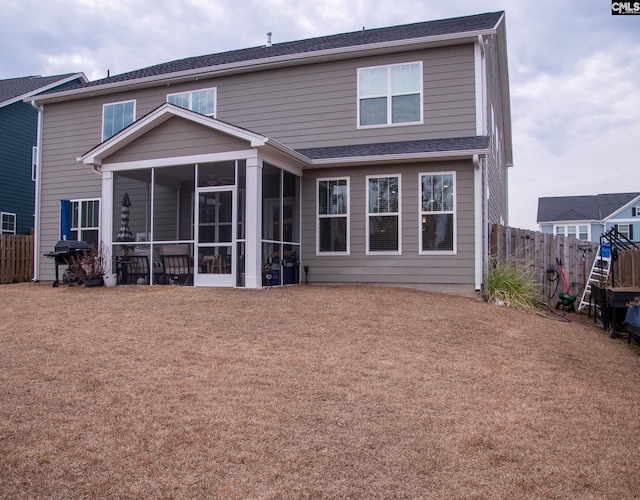 rear view of house with a sunroom