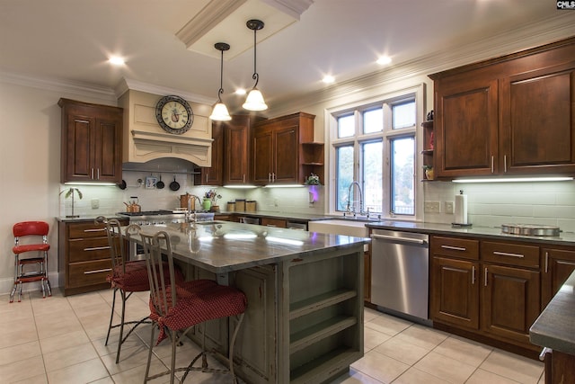 kitchen with stainless steel dishwasher, ornamental molding, a center island, and backsplash