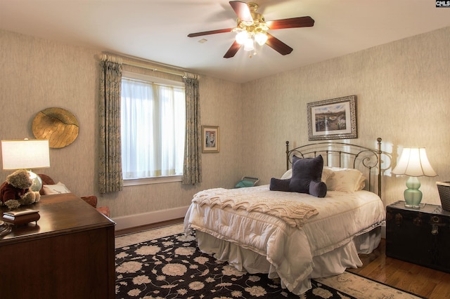 bedroom featuring hardwood / wood-style floors and ceiling fan