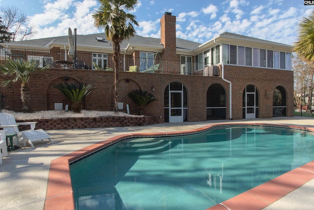 view of pool featuring a patio area