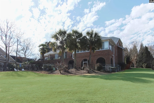 back of house with a yard