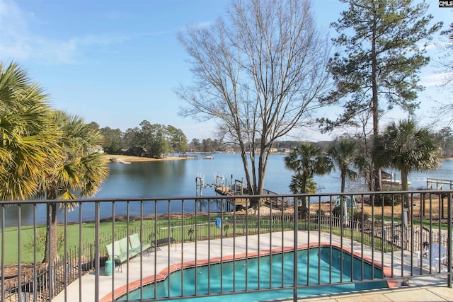 view of pool with a water view