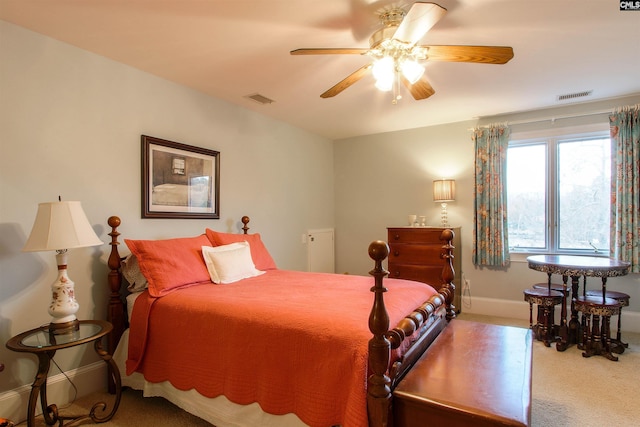 bedroom featuring ceiling fan and carpet