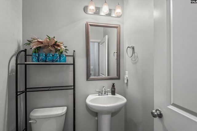 bathroom featuring sink and toilet