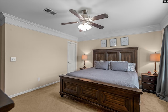 carpeted bedroom with ceiling fan and ornamental molding