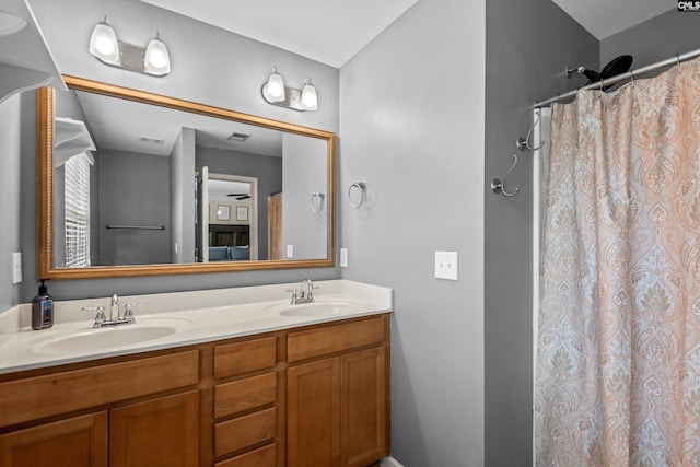 bathroom featuring vanity and a shower with curtain