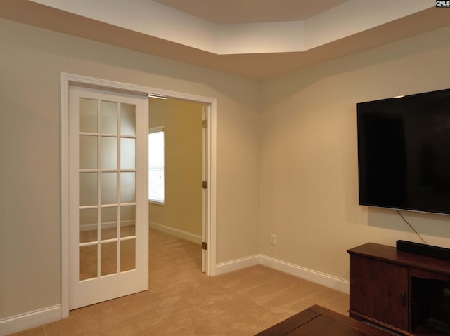 interior space featuring light colored carpet