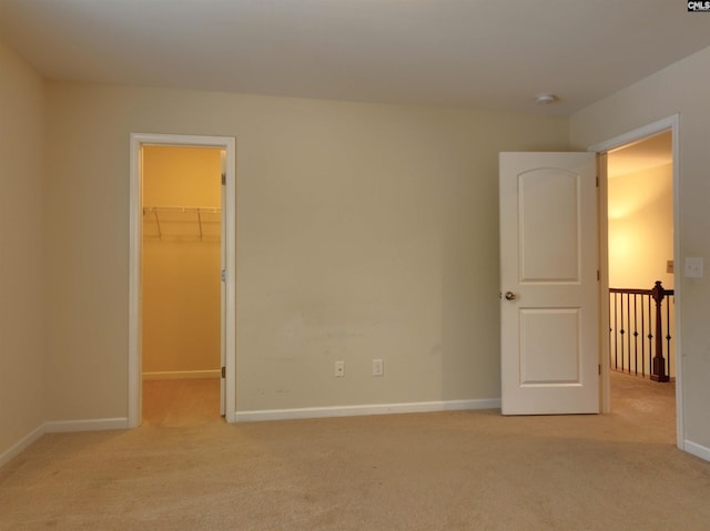 unfurnished room with light colored carpet