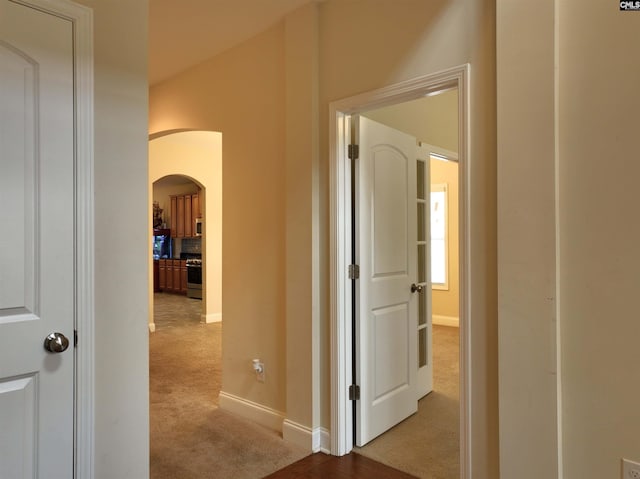 corridor with light carpet