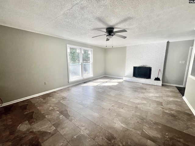 unfurnished living room featuring ceiling fan, a fireplace, ornamental molding, and a textured ceiling