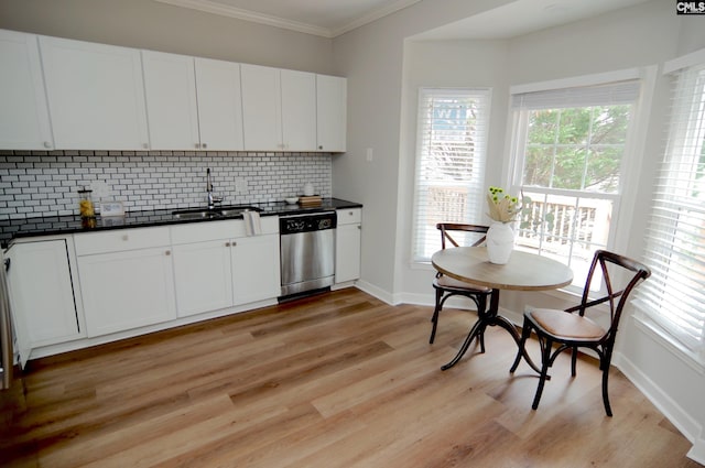 kitchen with sink, crown molding, dishwasher, white cabinets, and decorative backsplash