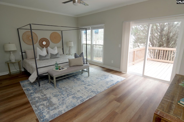 bedroom featuring crown molding, wood-type flooring, and access to outside