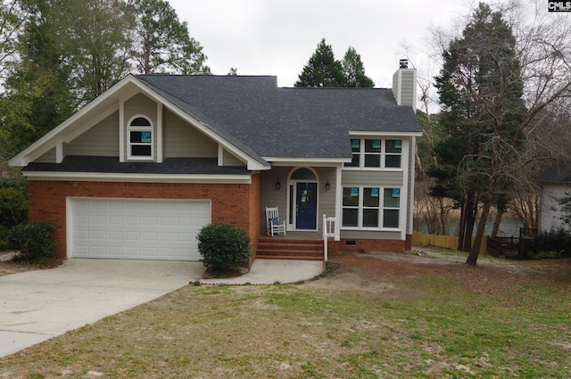 view of front of house featuring a garage and a front lawn