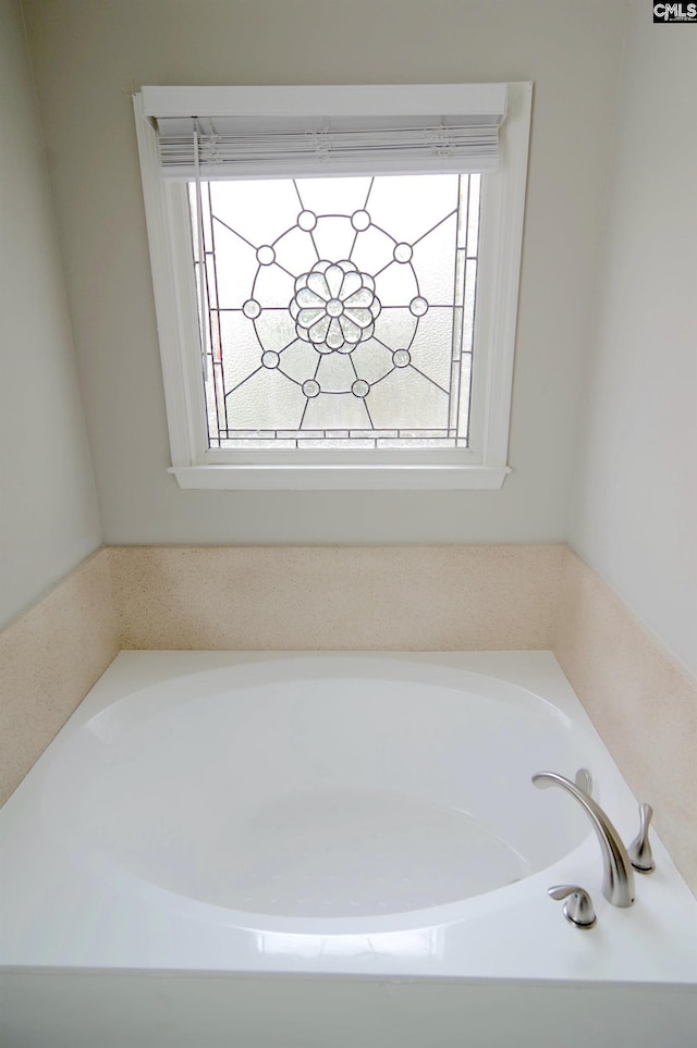 bathroom with a washtub