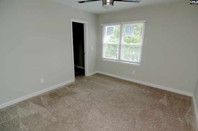 carpeted empty room with ceiling fan