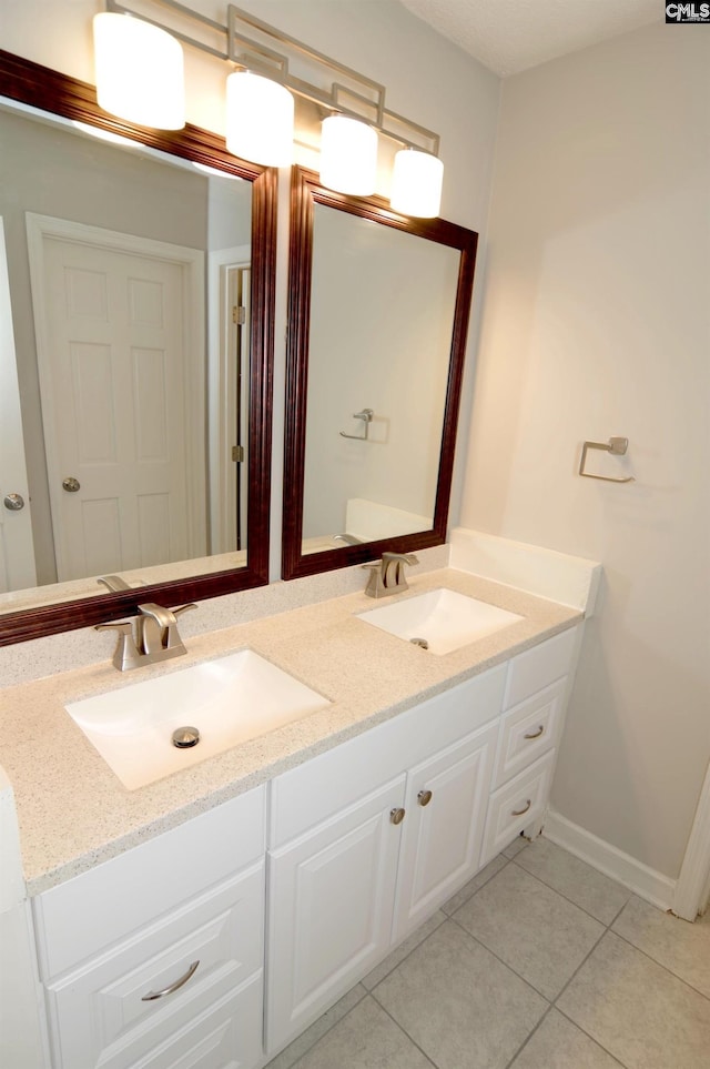 bathroom featuring vanity and tile patterned flooring