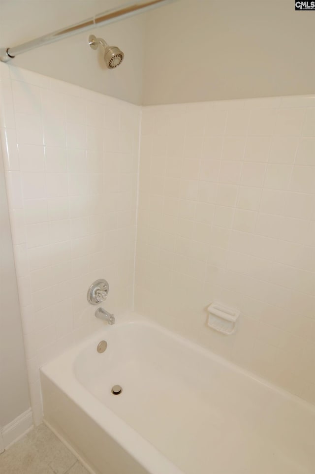 bathroom with tile patterned flooring and shower / bathing tub combination