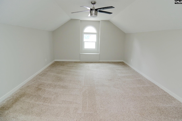 bonus room featuring lofted ceiling, light colored carpet, and ceiling fan