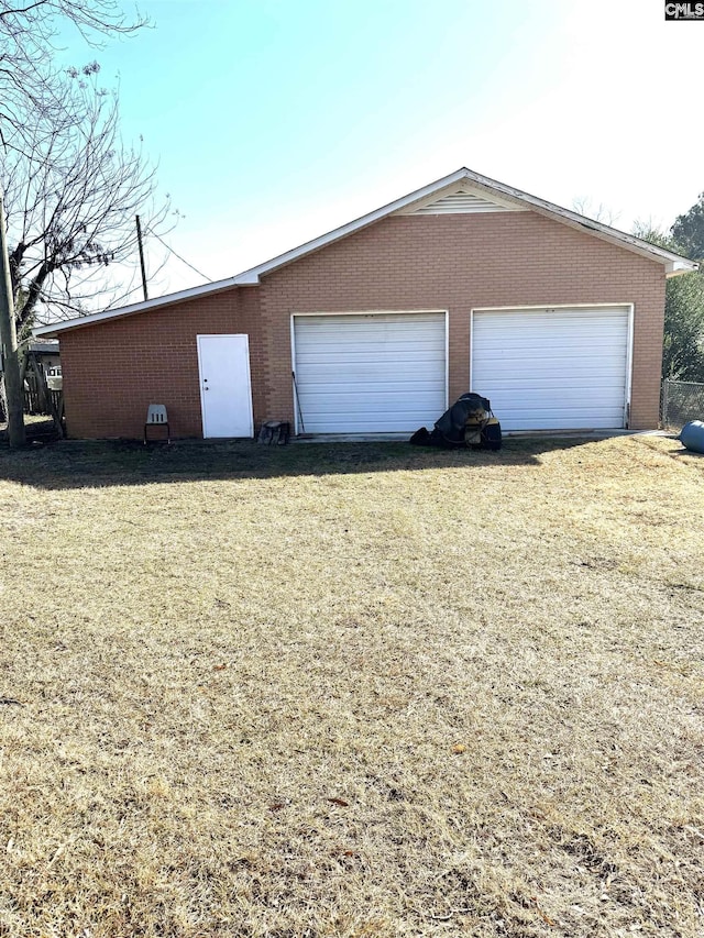 garage with a yard