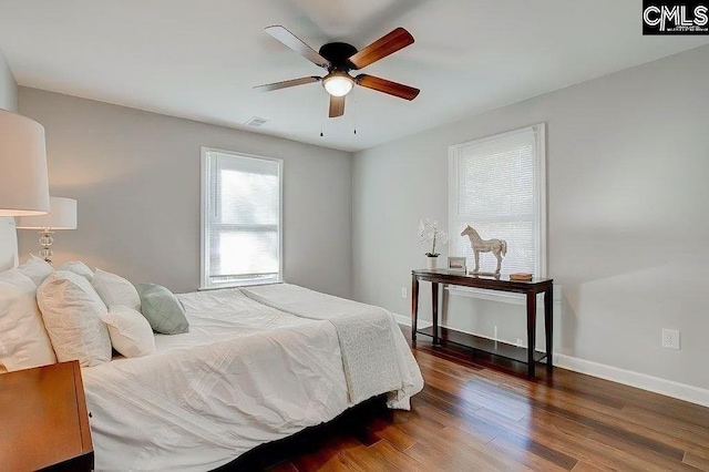 bedroom featuring dark hardwood / wood-style floors and ceiling fan