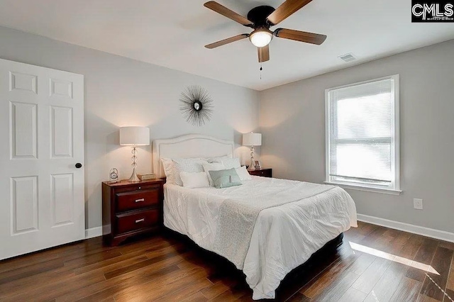 bedroom featuring ceiling fan and dark hardwood / wood-style flooring