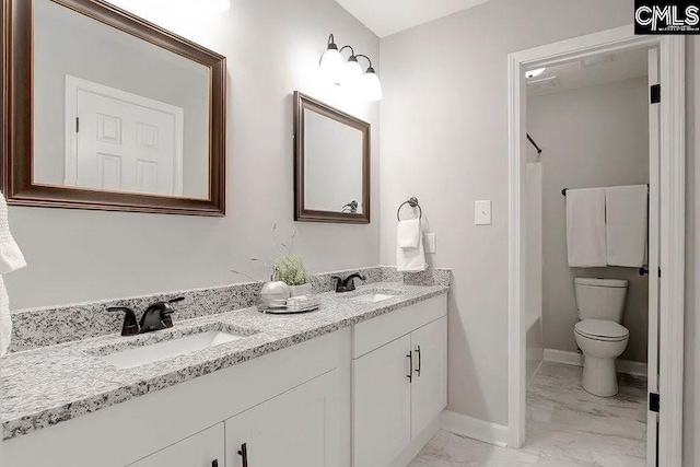 full bathroom with vanity, washtub / shower combination, and toilet