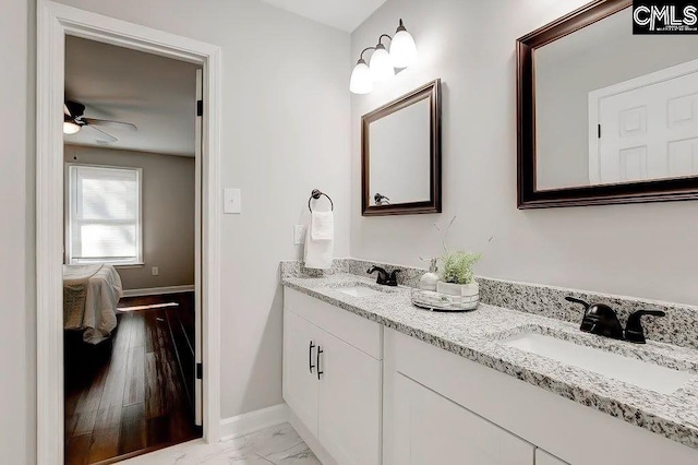 bathroom featuring vanity and ceiling fan