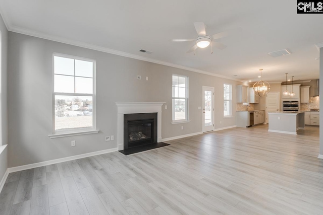 unfurnished living room with light wood-type flooring, a fireplace with flush hearth, and ornamental molding