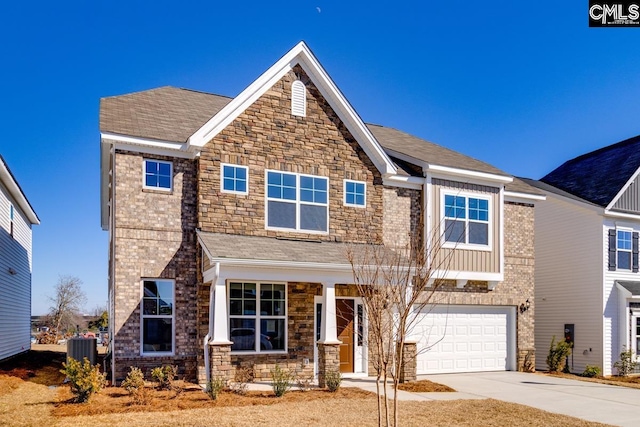 craftsman house featuring brick siding, a shingled roof, a garage, cooling unit, and driveway