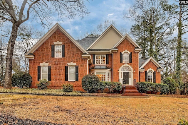 front facade with a front yard