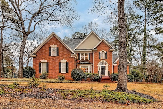 front facade with a front yard