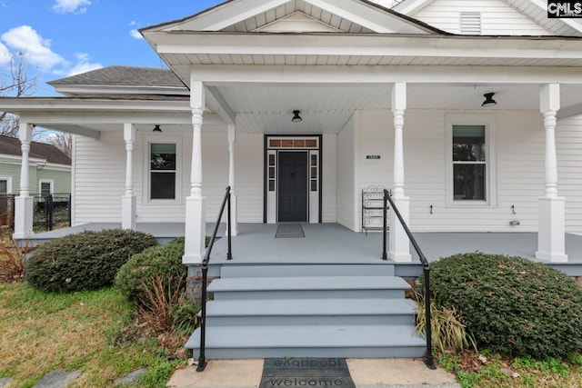 entrance to property featuring a porch