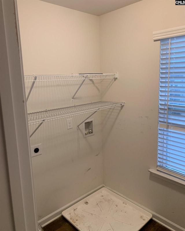 clothes washing area featuring washer hookup and hookup for an electric dryer