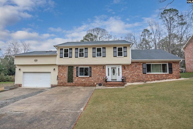 view of front of property with a garage and a front yard