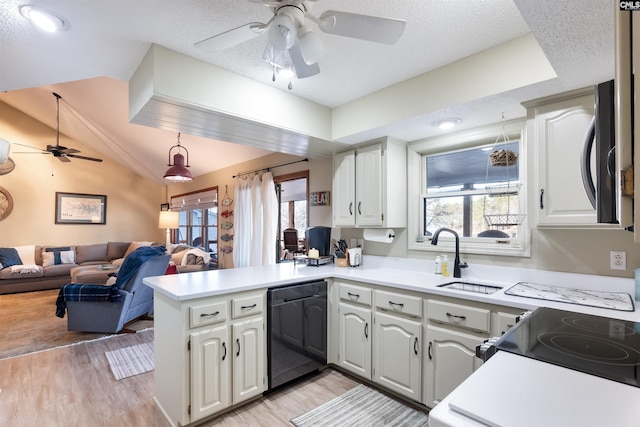 kitchen with white cabinetry, dishwasher, and kitchen peninsula