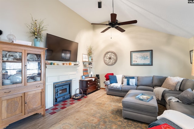 living room featuring lofted ceiling, dark hardwood / wood-style floors, and ceiling fan