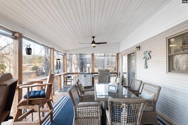 sunroom / solarium with ceiling fan and a healthy amount of sunlight