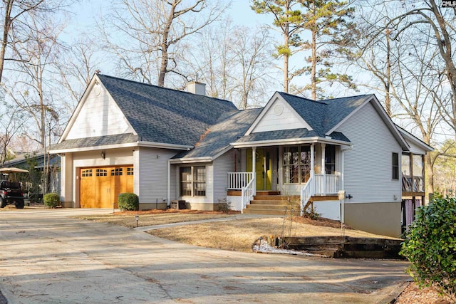 view of front of property featuring a garage and a porch