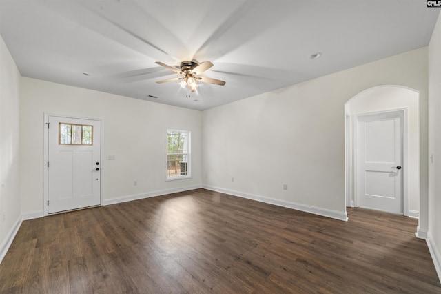 interior space with ceiling fan and dark hardwood / wood-style floors