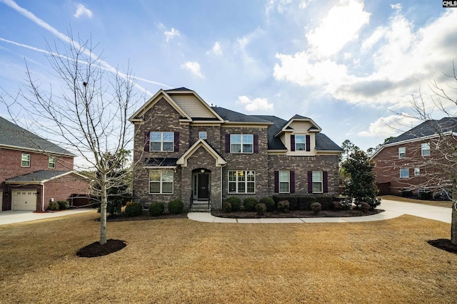 craftsman inspired home featuring a garage and a front yard