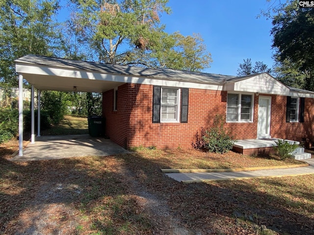 view of front of home featuring a carport