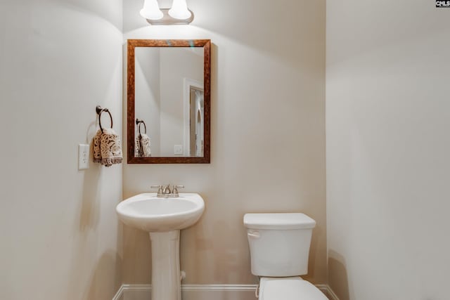 bathroom with sink and toilet