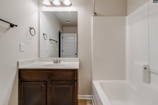 bathroom with vanity and shower / tub combination